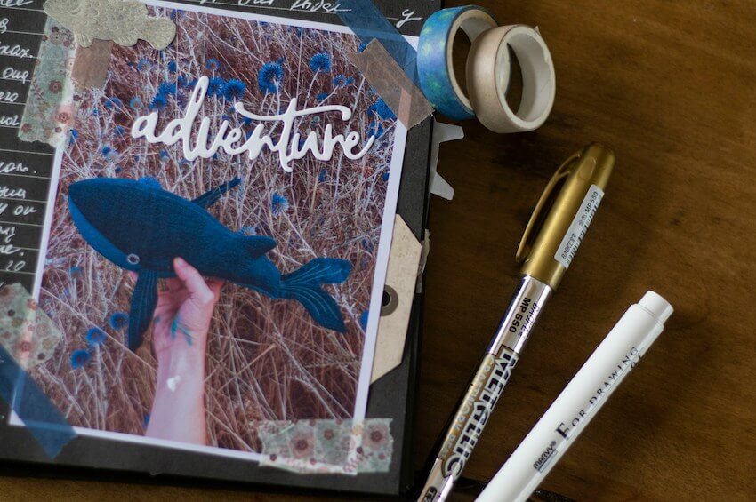 adventure page of a memory book with a picture of a shark toy