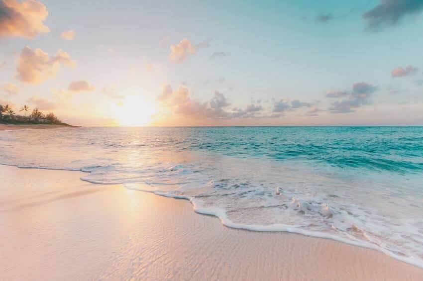 a beautiful beach at sunrise