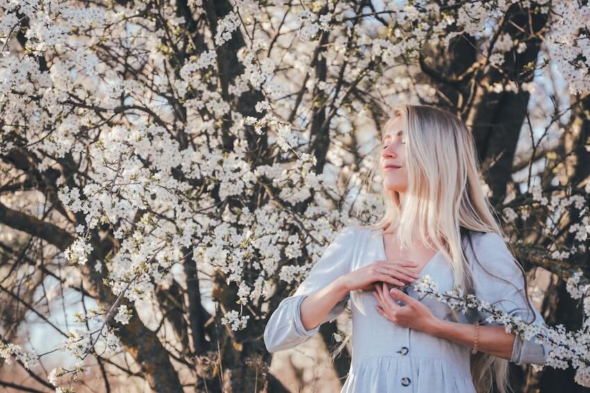 woman breathing deeply outside