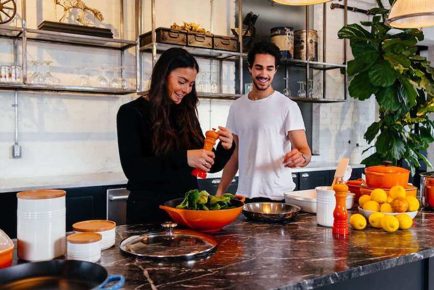 friends cooking a meal together