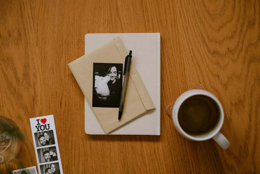 envelope with a handwritten letter and personal photos