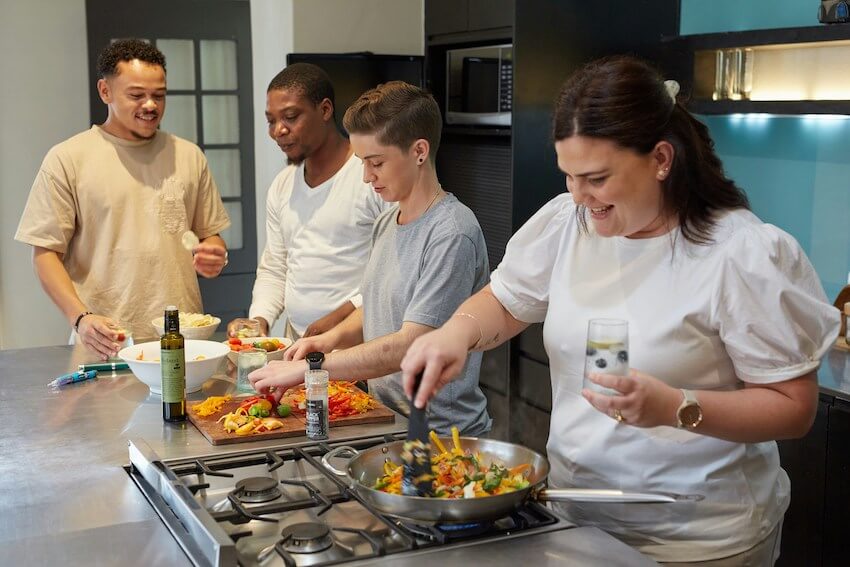 friends cooking a meal together