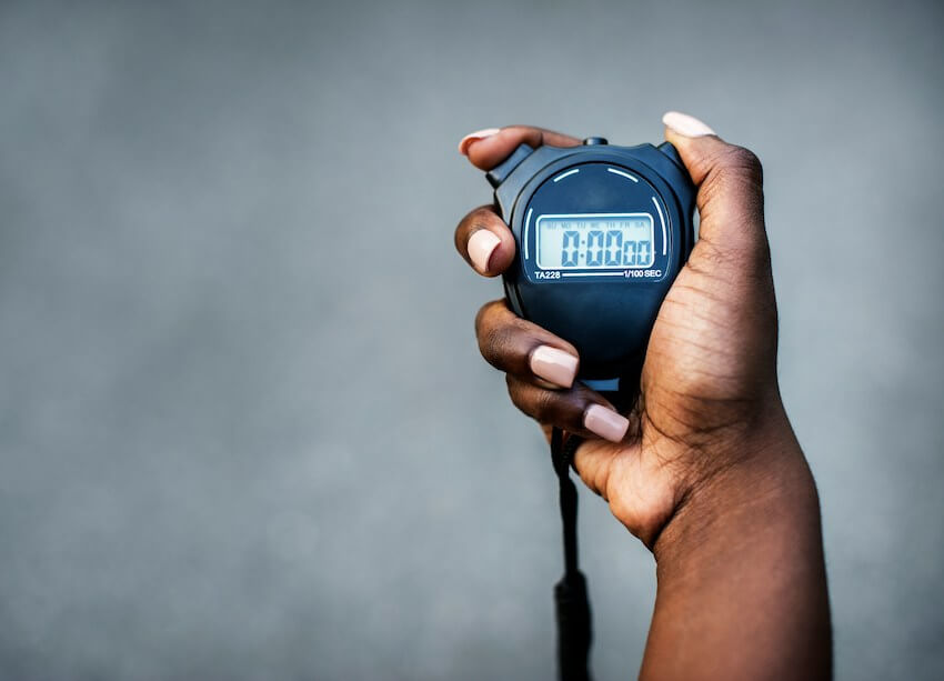 hand holding a stopwatch timer