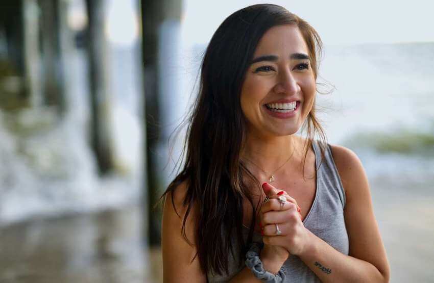 happy woman clasping her hands