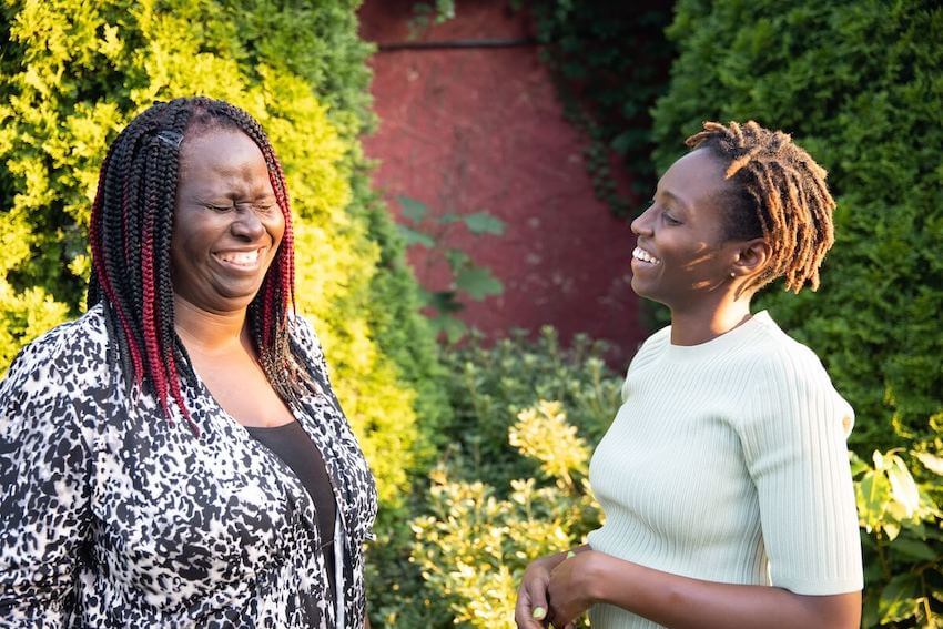 two women laughing during a funny conversation