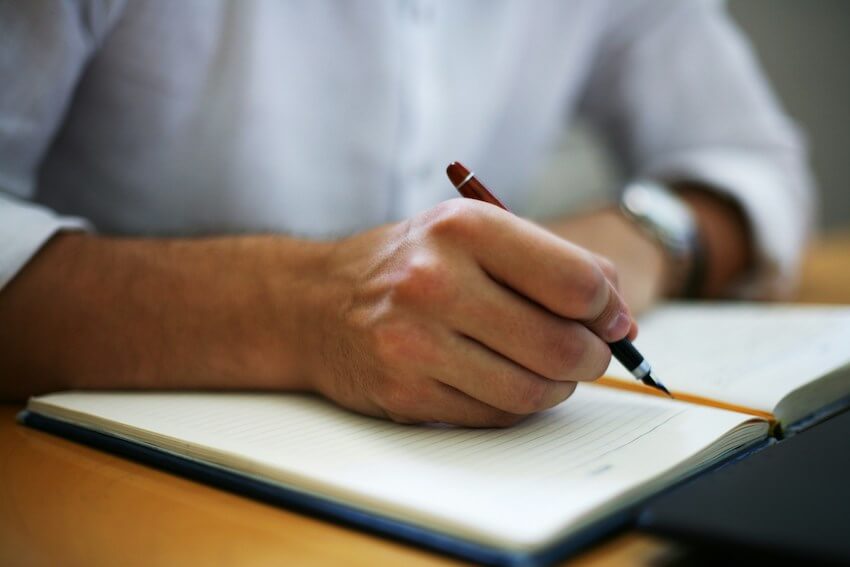 man journaling