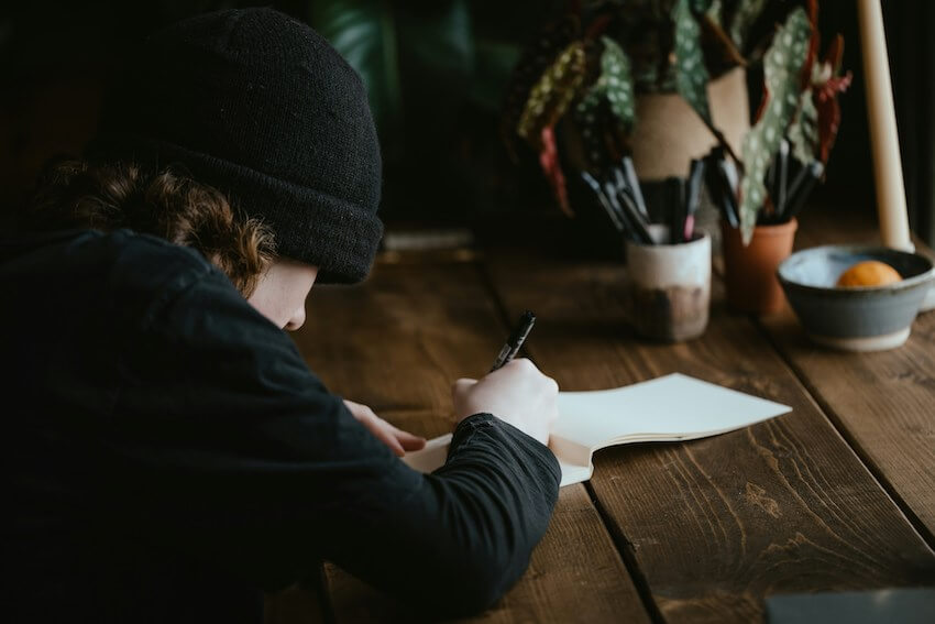 man journaling