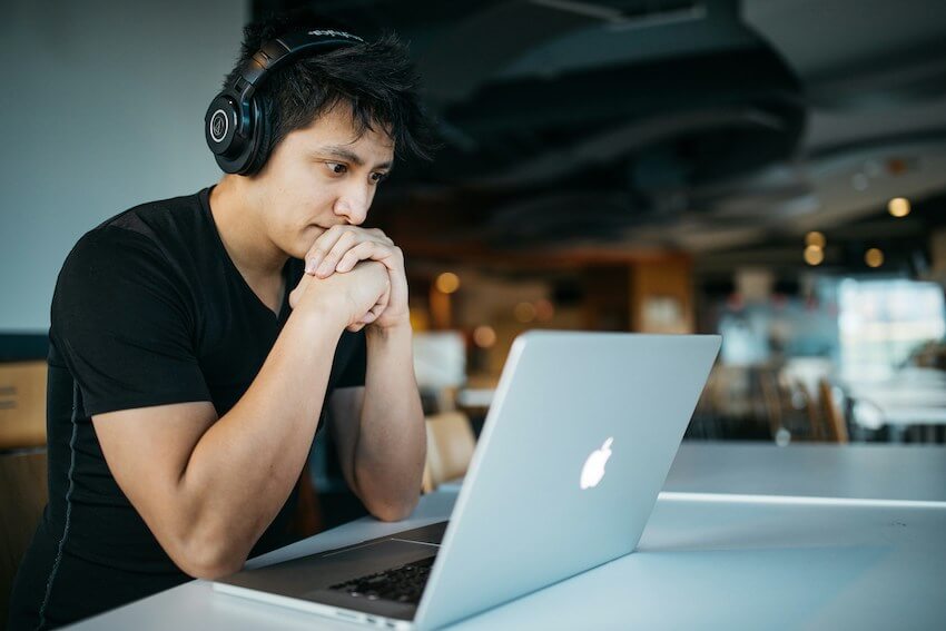 man learning on his laptop