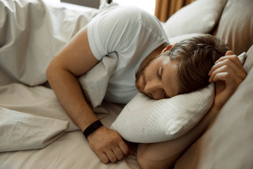 man sleeping in bed