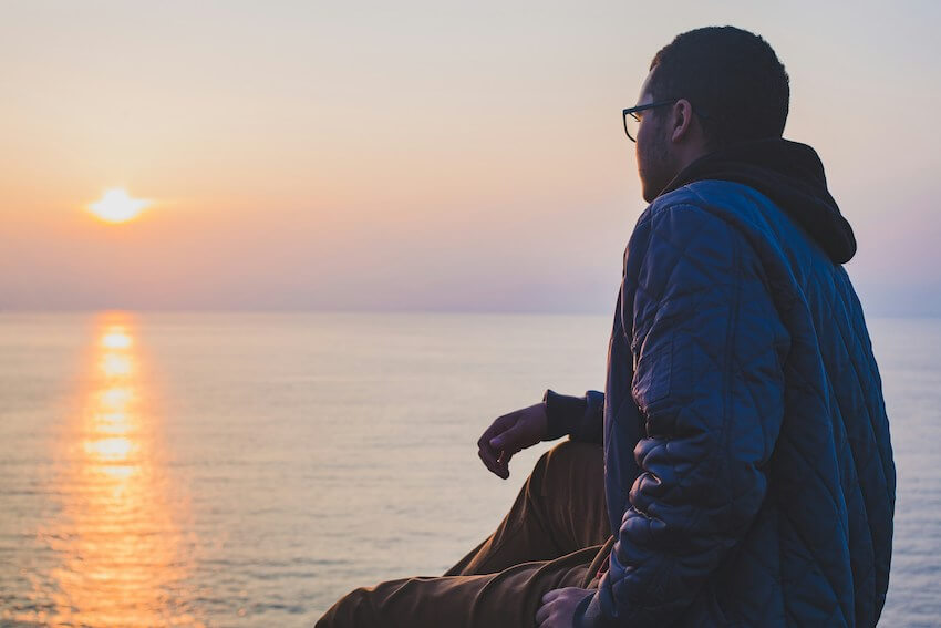 man watching the sunset