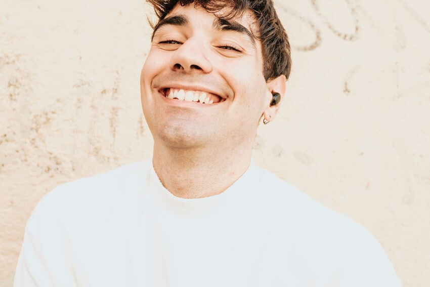 man with a huge grin on his face