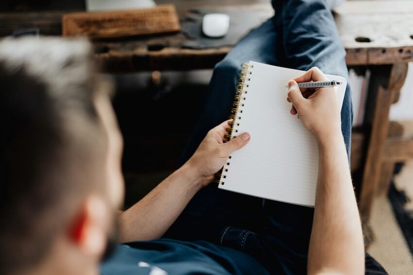 man writing a message