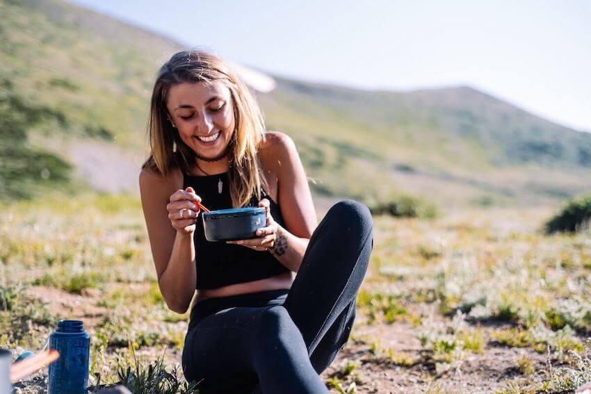woman savoring her meal outside