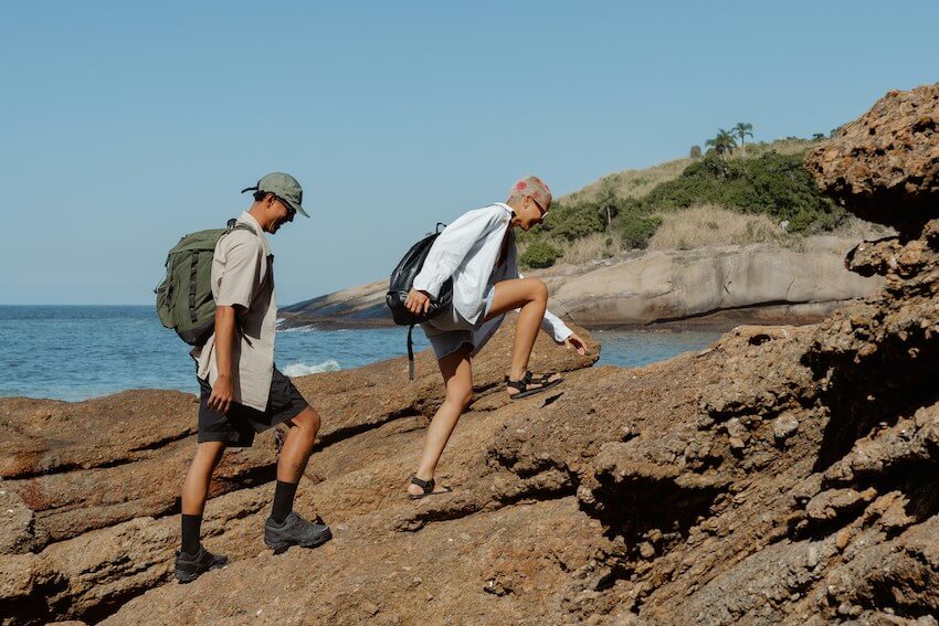 smiling male friends on a hike