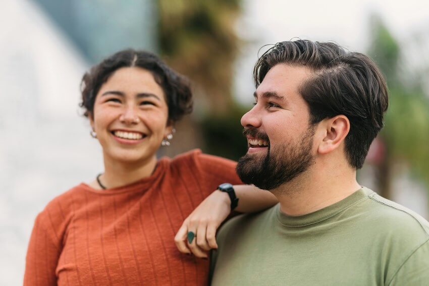 two people laughing at a funny story