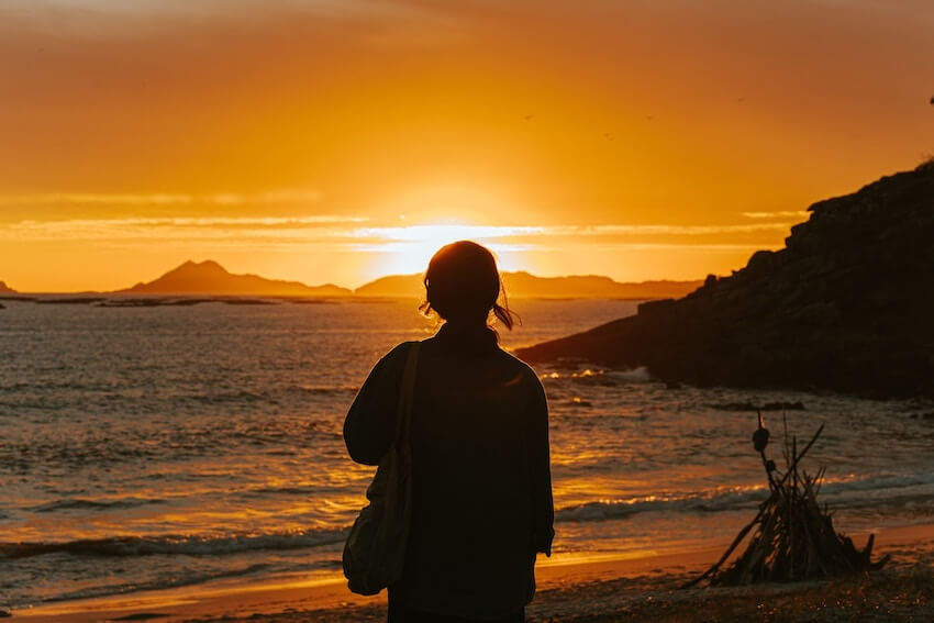 woman admiring the sunset