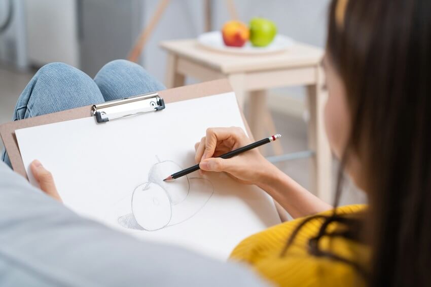 woman drawing apples