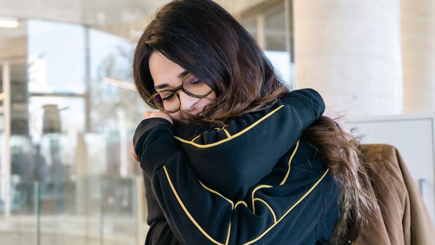 woman giving herself a hug