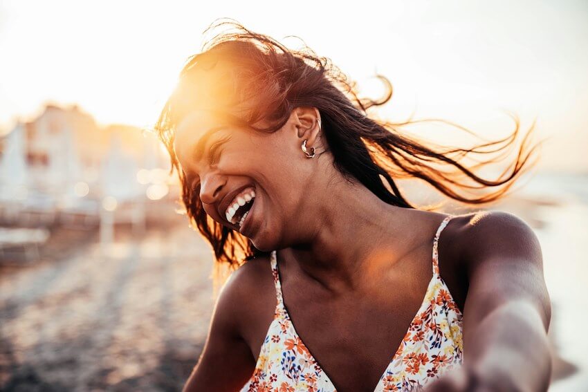 woman laughing in a way that is contagious