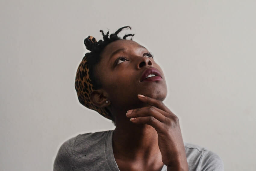 woman looking up lost in thought