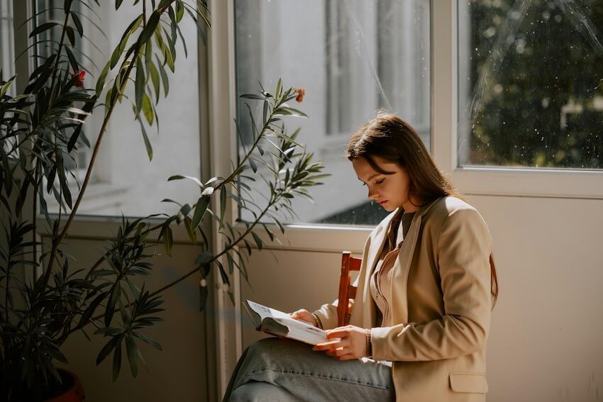 woman peacefully reading a book