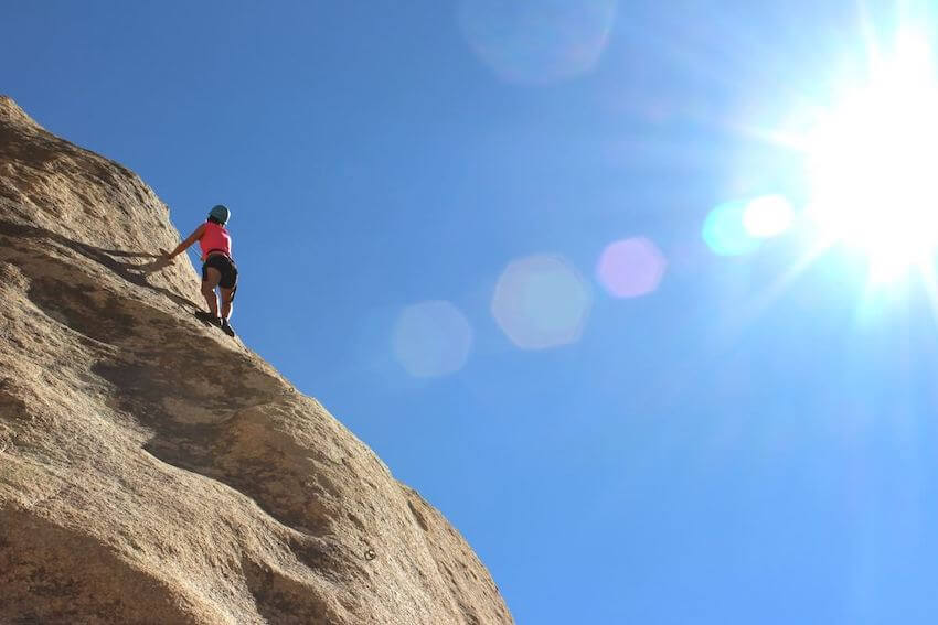 woman rock climbing