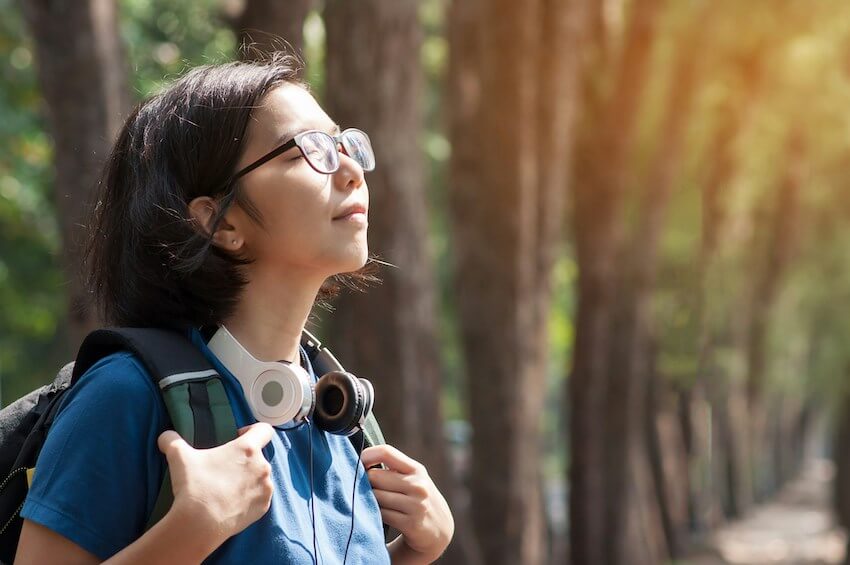 woman taking a deep breath