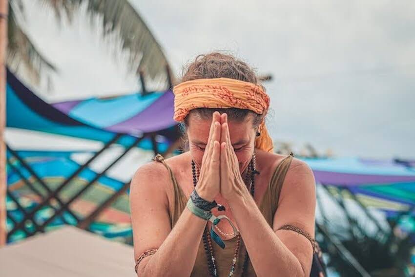 woman with her hands together in gratitude