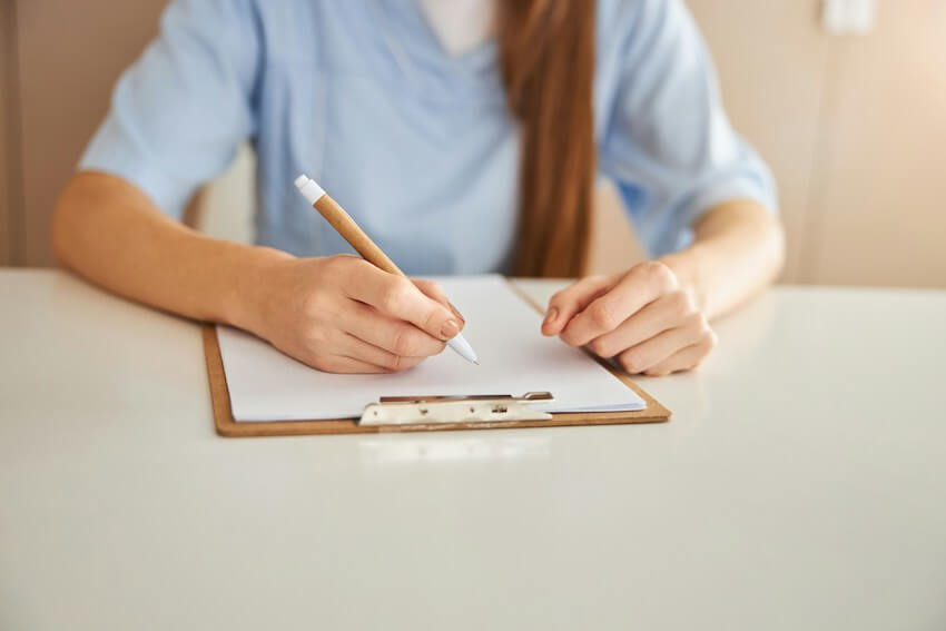 woman writing a list