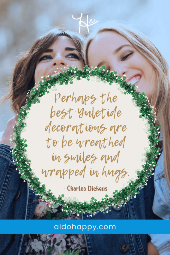 Stylized quote from a little dose of happy: "Perhaps the best Yuletide decorations are to be wreathed in smiles and wrapped in hugs" by Charles Dickens