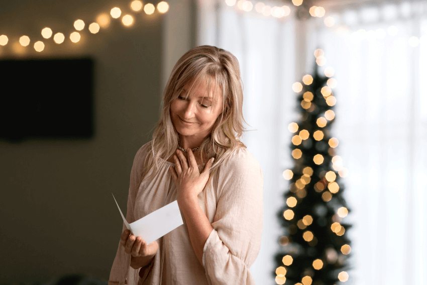 woman touched by the holiday card message