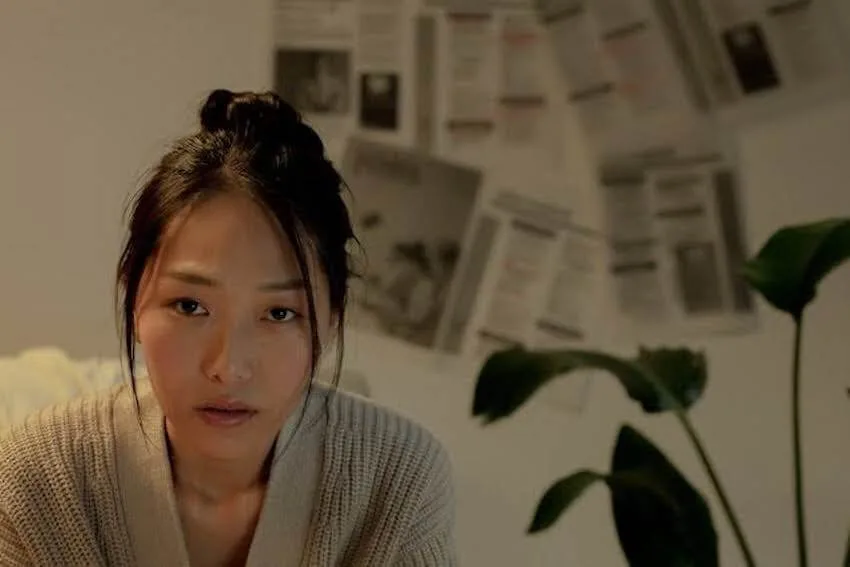Asian woman looking worried