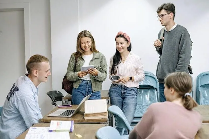 classmates having a happy conversation