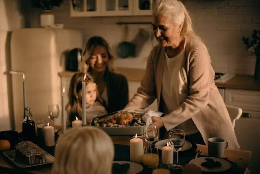 grandma presenting turkey dinner