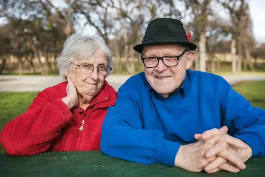 happy elderly couple looking at the camera