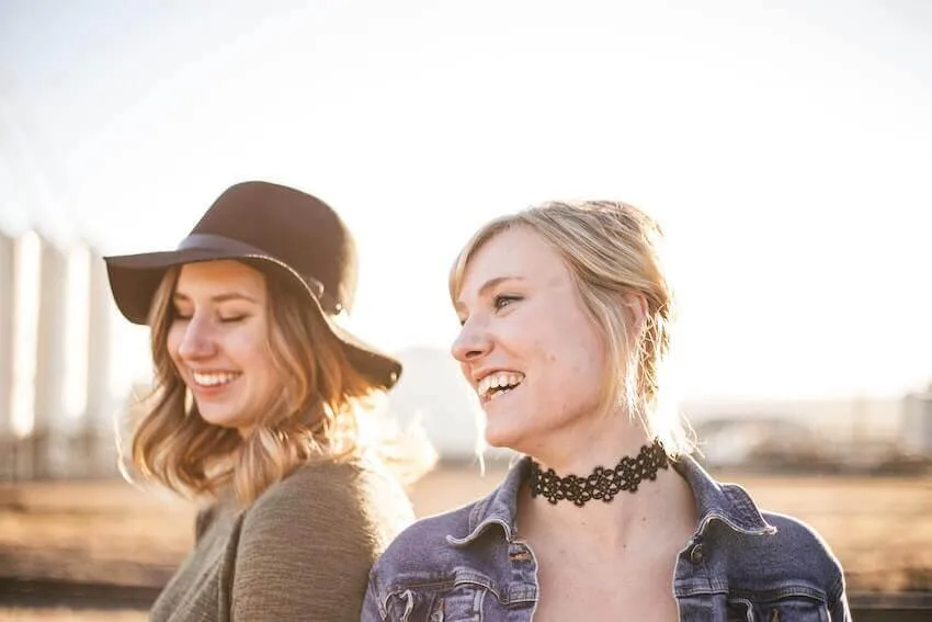 two women enjoying a laugh together