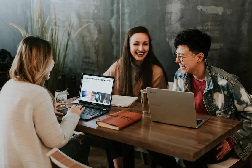 group of women enjoying a happy conversation while studying together