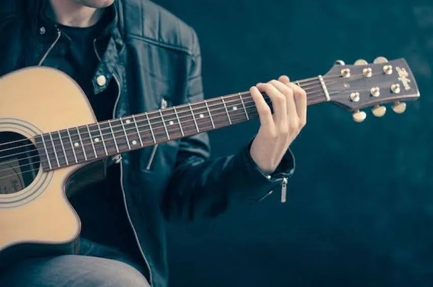 man playing a guitar