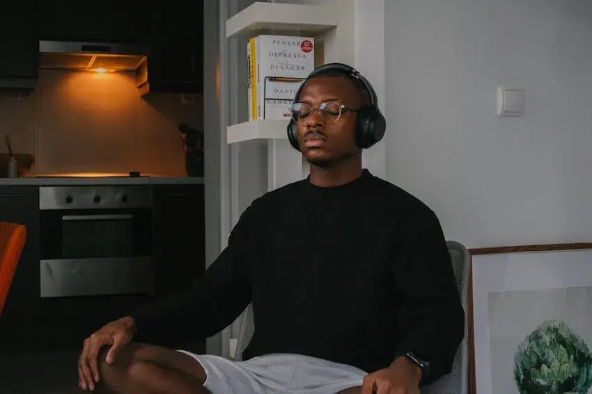 man sitting crossed legged with his eyes closed