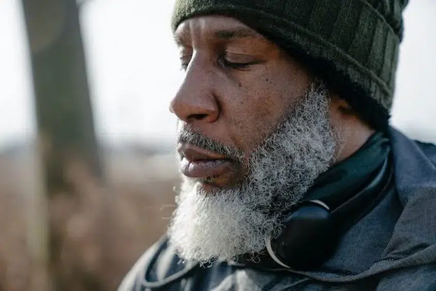 man taking a deep breath