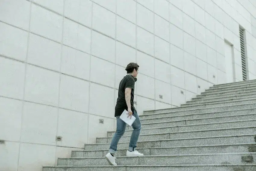 man walking up stairs