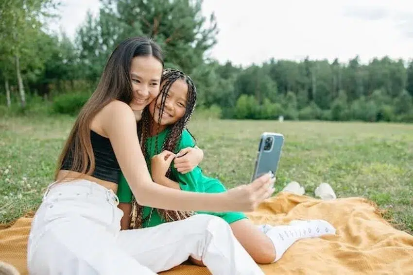mom and daughter taking a selfie