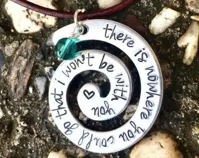spiral pendant that says, "there is nowhere you could go that I won't be with you" from the company Natashaaloha on Etsy