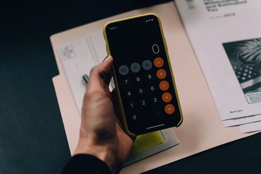 woman's hand holding a calculator