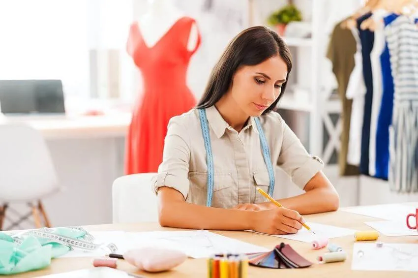 woman designer sketching a new clothing design