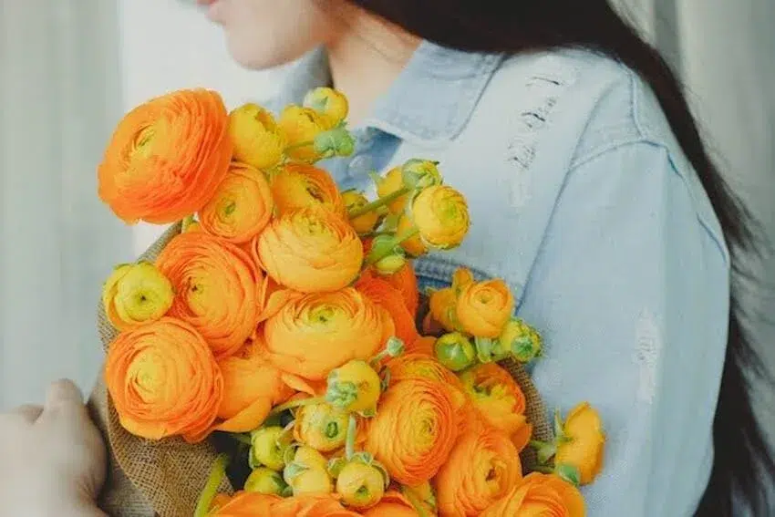 Woman holding a beautiful bouquet of flowers