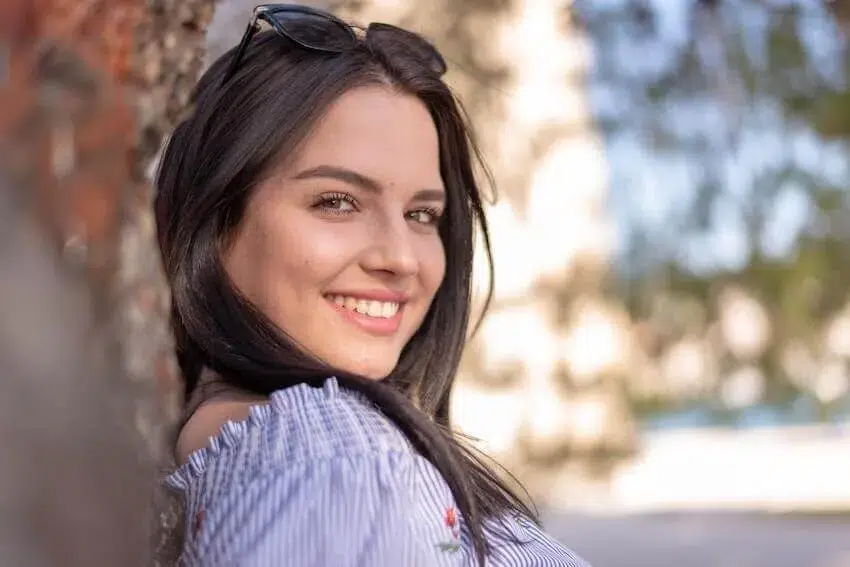 a smiling woman looking at the camera