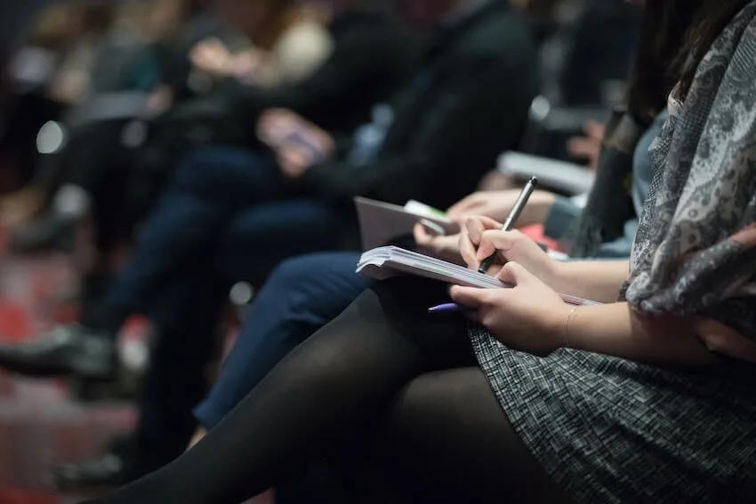 students taking notes during a lecture