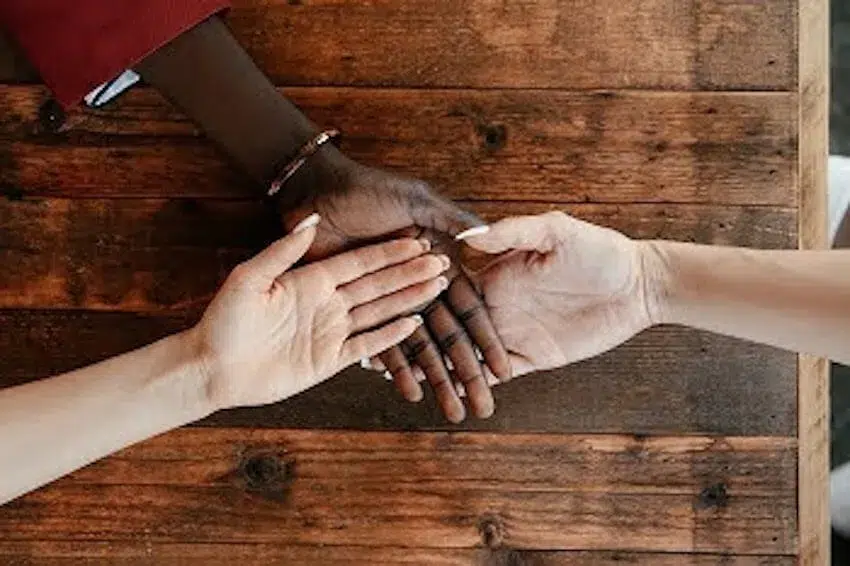 three overlapping hands