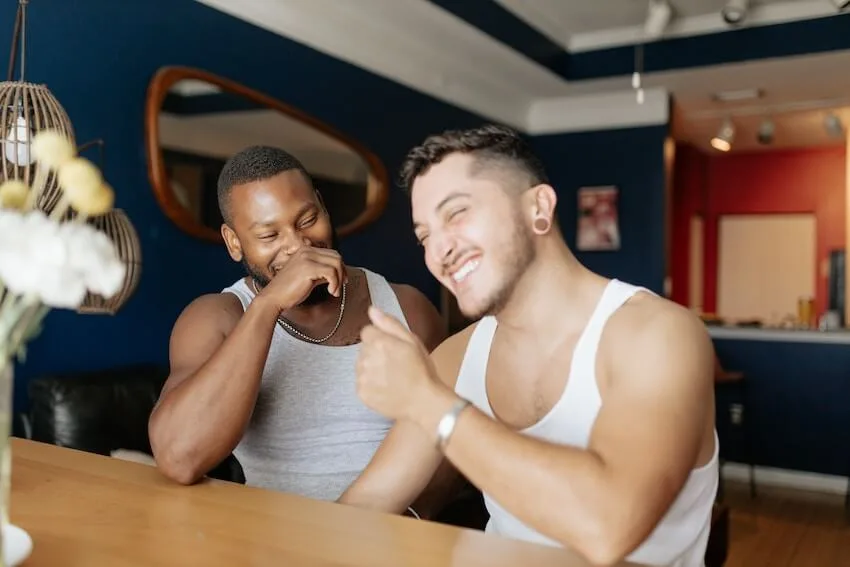 two men laughing together